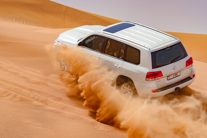 Dubai Morning Evening Desert Safari,Sand boarding and Camel ride - Sandboarding on the dunes, the part that feels like a cheat code