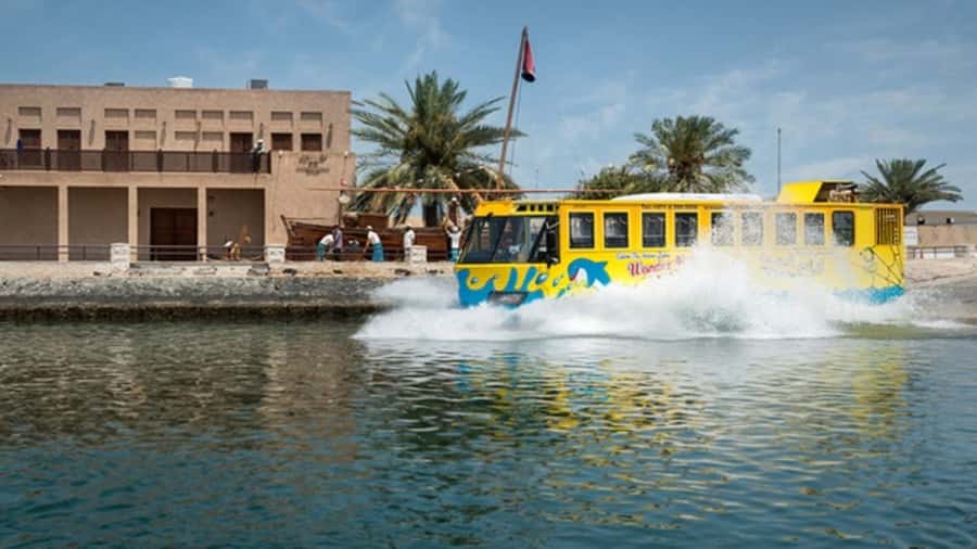 Dubai: Old town tour with Wonder Bus, souks, Creek and Guide - Dubai Creek, abra boats, and the big splash moment