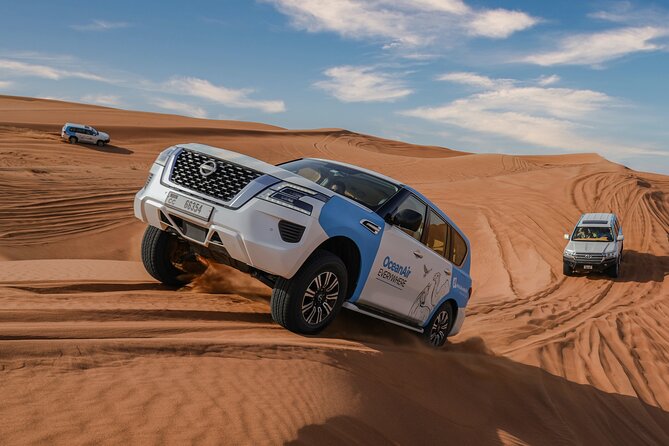 Dubai Overnight Desert Safari, BBQ & Stargazing at Al Khayma Camp - Stop in Lahbab: dune bashing, sandboarding, and pacing your energy