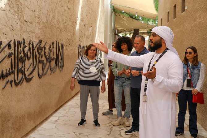 Dubai: Photography Tour in Al Fahidi District w/Abra Ride - Al Khayma Heritage House, Tea With Dates, and Local Sweet Bites