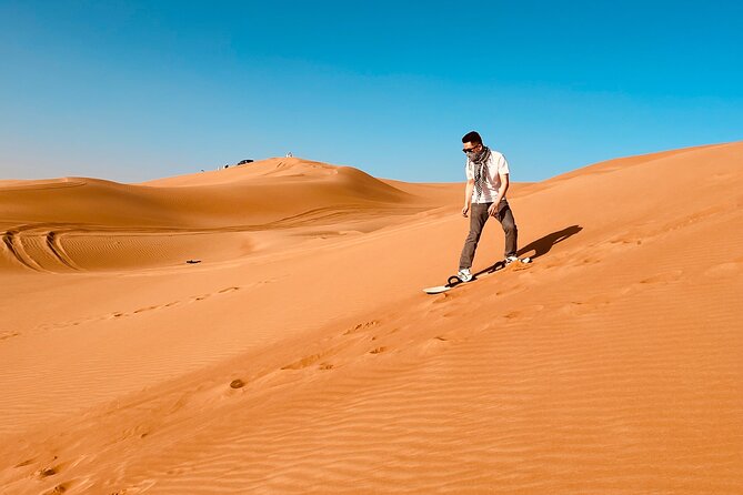 Dubai Premium Desert Safari Red Duns Camel sandbord & Premium BBQ - Lahbab Red Dunes: Sandboarding Energy and Add-On Reality