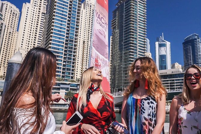 Dubai Private Boat Charter with Optional World Islands Upgrade - Service details that change the feel: red carpet entry, water, and crew care