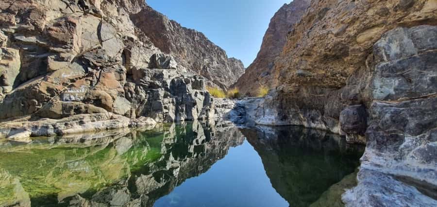 Dubai: Private Desert Day Tour and Wadi Shawka Pool Visit - Sharjah photo stop and dune bashing, the quick adrenaline hit