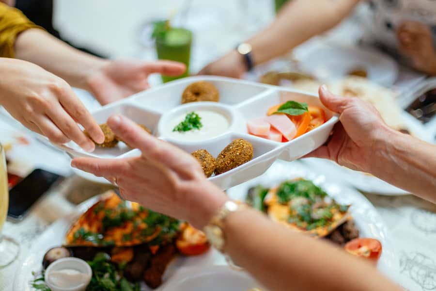Dubai: Private Food Tour – 10 Tastings with Locals - Old Dubai markets: Spice Souk, Textile Souk, and Indian Temple Street
