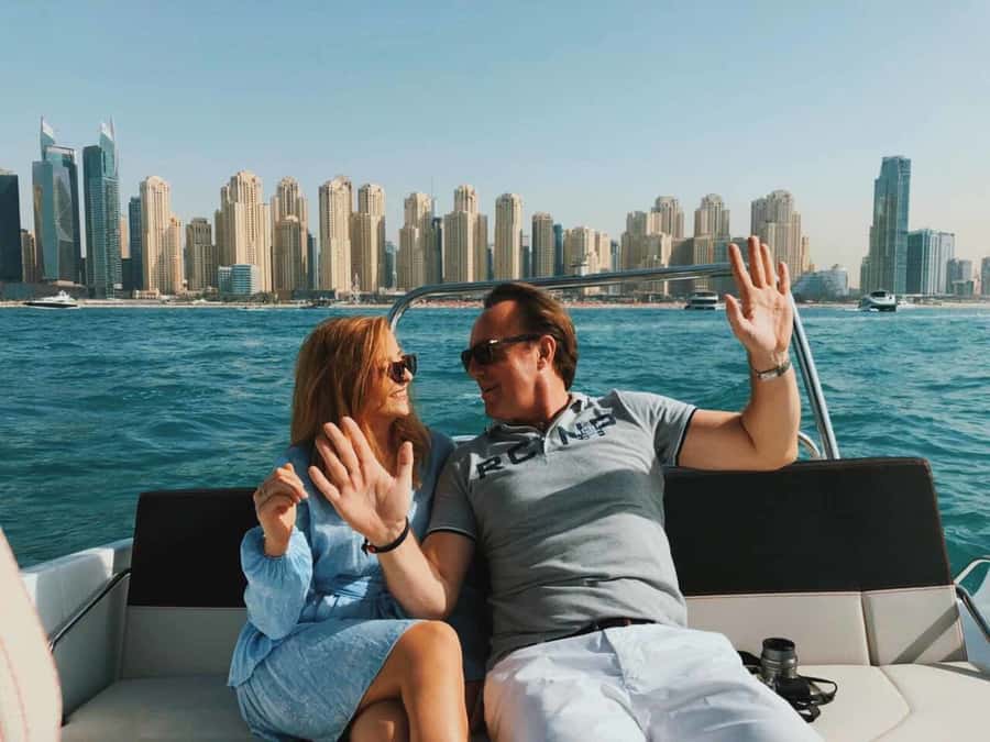 Dubai: Private Sea Escape Cruise - Swim, Tan & Sightsee - Your captain experience: music, photos, and a relaxed guide style