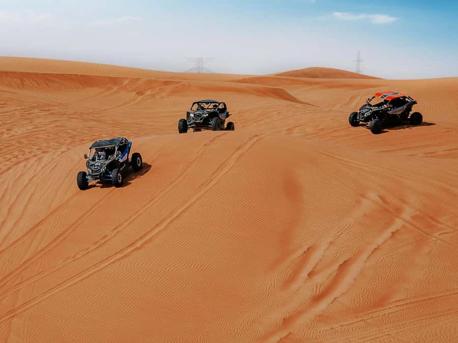 Dubai: Quad Bike or Dune Buggy Adventure & Optional Transfer - Desert Camp Evening: Tea, BBQ Buffet, and Live Shows Under Stars