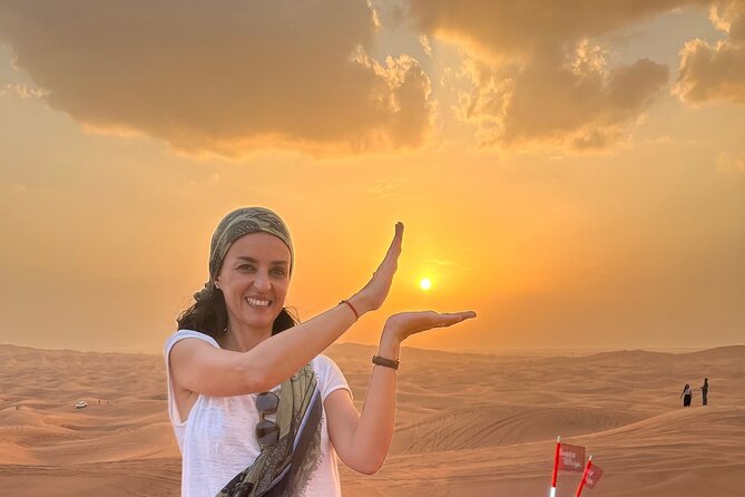 Dubai Red Desert Safari sharing basis with Camel, Shows & Dinner - Sand boarding: turning sand into a downhill workout