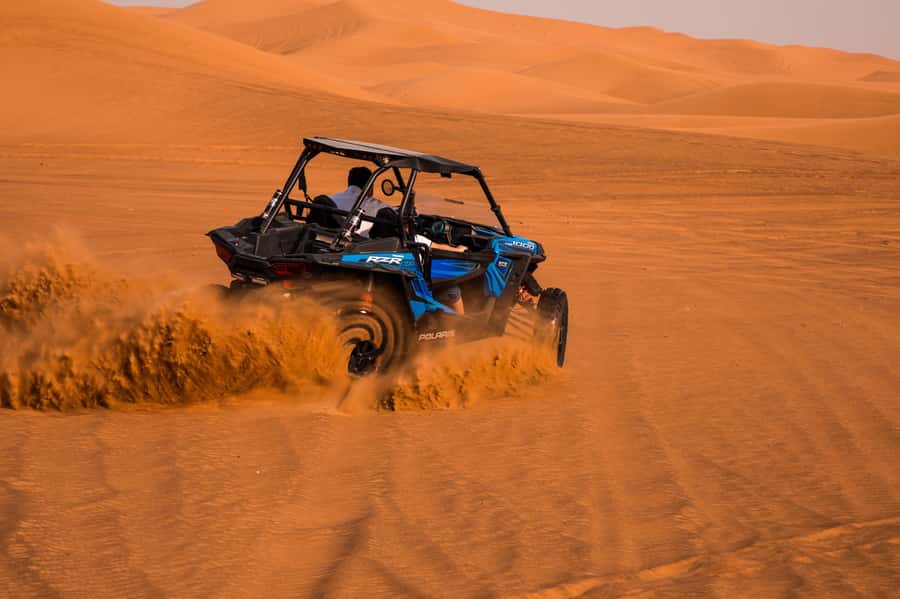 Dubai: Red Dune Desert Safari, Quad Bike, Camels, and BBQ - Entering The Red Dune Desert Safari, where the action starts