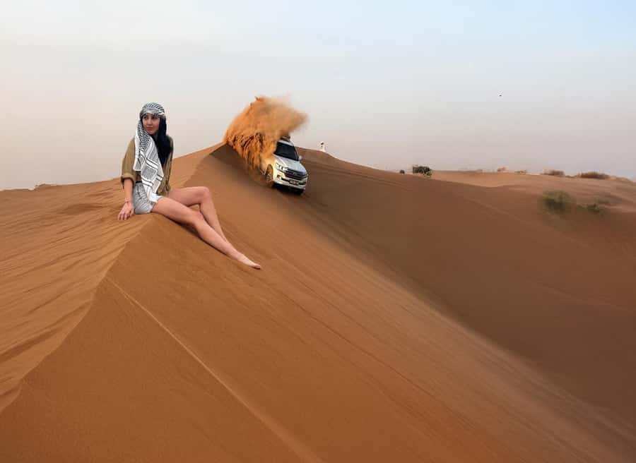Dubai: Red Dunes Desert Safari with Premium Camp BBQ & Shows - Falcon photos and the short camel ride: classic Dubai, quick and fun