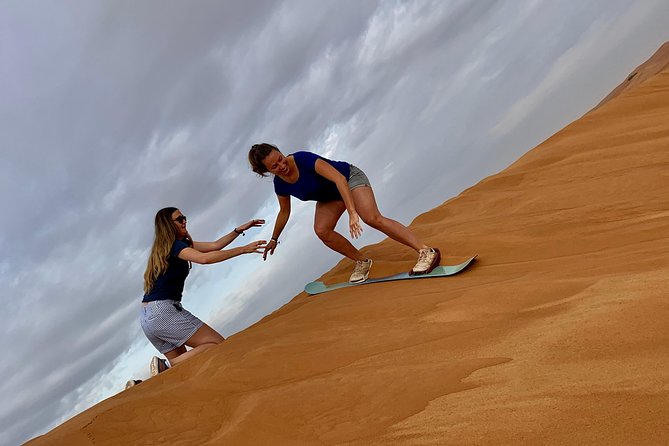 Dubai Red Dunes Quad Bike Tour,Sandboard, Camel ride & BBQ Dinner - Camp Time at Sunset: Falcons, Henna, and Shisha Without the Fuss