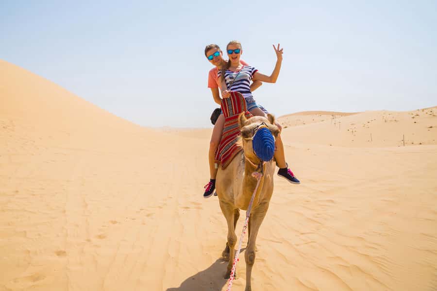 Dubai: Red Dunes Quad Bike with Sandboarding, Camels and BBQ - Where the Lahbab Desert experience feels different from a city tour