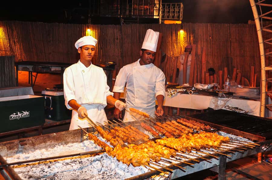 Dubai: Safari, Quad Bike, Camel Ride, and Buffet Dinner - The Comfortable Start: Air-Conditioned 4WD and the Desert Base Camp