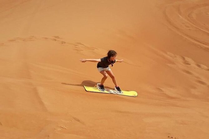Dubai Self-drive Quad Bike, Sand Boarding, Camels & Refreshments - Sandboarding: The Best Way to Turn a View Into Motion