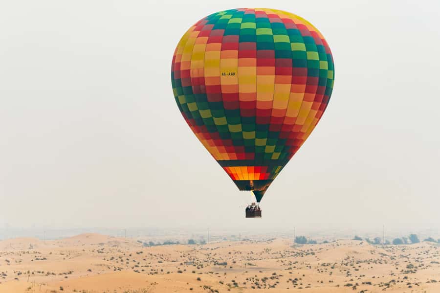 Dubai: Sunrise Balloon Flight with Camel Ride & Breakfast - At the Balloon Base: Tea, Safety Briefing, and Watching the Baskets Prepare