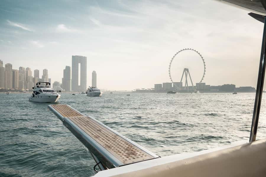 Dubai: Sunset & Night Cruise with Bites and Drinks - Meeting at Dubai Harbour, getting to the boat, then settling in