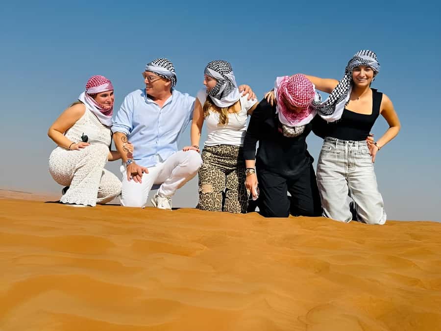 Dubai: Tour with BBQ Dinner, Camel Ride, & Traditional Show - Bedouin Camp Time: Camel Ride, Henna, Falcon Photos, and Shisha