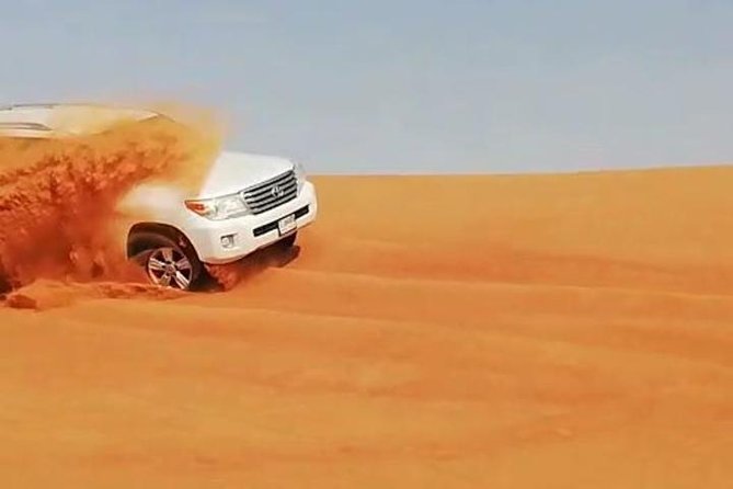 Dubai: Unique MORNING 4WD Red Dunes Safari incl. 30min Quad Bike - Sandboarding and camel ride: fast sliding, slow reset