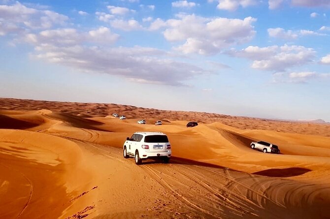 Dubai: Unique MORNING 4WD Red Dunes Safari - Sandboarding: the included way to slide down dunes