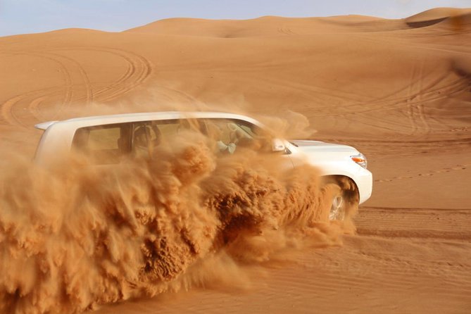 Dubai: Unique SUNSET 4WD Red Dunes Safari - Desert camp evening: BBQ, belly dance, and the fun extras