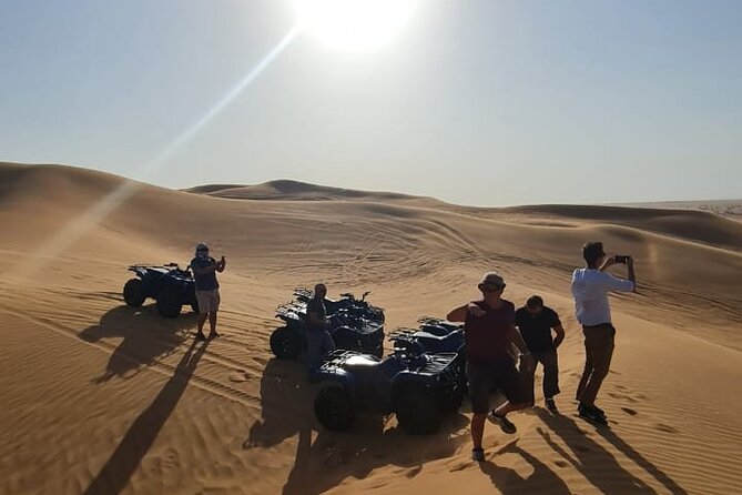Dubai Unique Sunset Combo: 4WD and Quad Bike Red Dunes Safari - The Desert Camp Evening: BBQ, Henna, and Live Performances