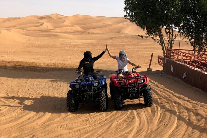 Dubai: Unique SUNSET Quad Bike Red Dunes Safari - Quick, high-impact things to know before you go