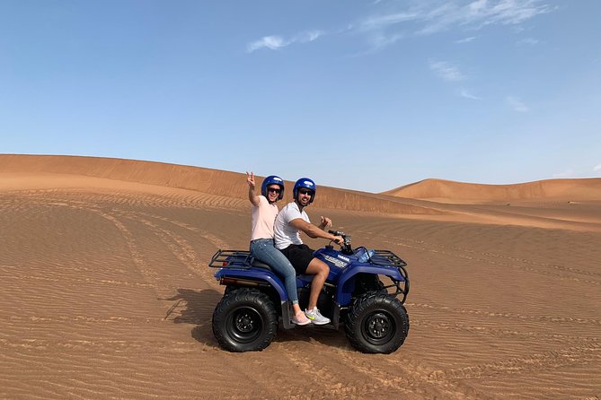 Dubai: Unique SUNSET Quad Bike Red Dunes Safari - The desert camp dinner and shows: what the evening is really like