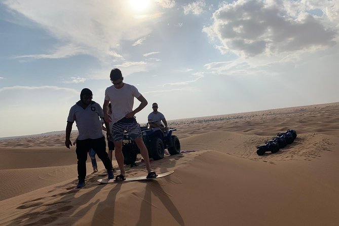Dubai: Unique SUNSET Quad Bike Red Dunes Safari - Pickup, timing, and what to do before you start