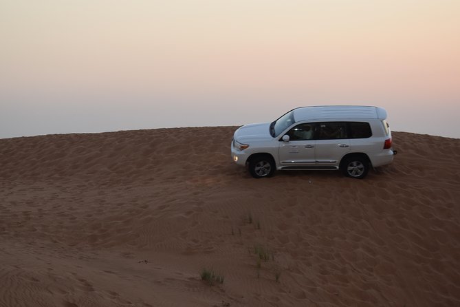 Dune Bashing with Quad Bike and Sand Boarding from Dubai - Base camp arrival: safety briefing, gear, and choosing your machine
