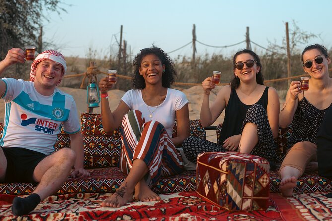 Evening Camel Caravan, Bedouin Dinner with Al Marmoom Oasis - Getting dressed up: kandura, abaya, and falcon photo time