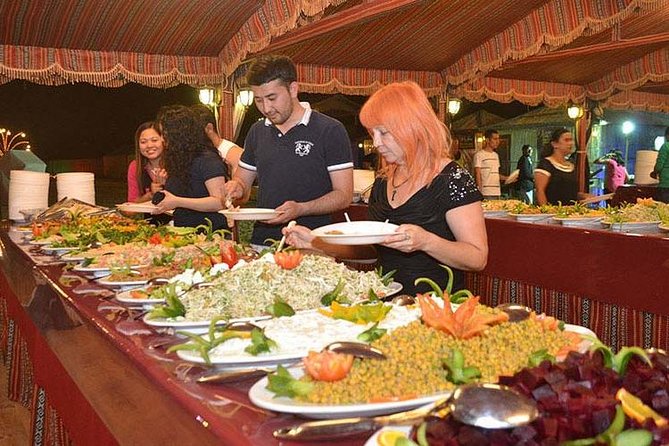 Evening Desert Adventure: Quad Biking, Sandboarding & Camel Ride - Food And Drinks: BBQ Dinner With Unlimited Soft Drinks