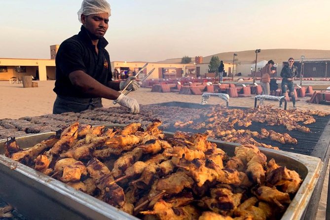 Evening Desert Safari BBQ Dinner With Quad Bike & Sand boarding - Camel farms, camel riding, and the falcon photo moment