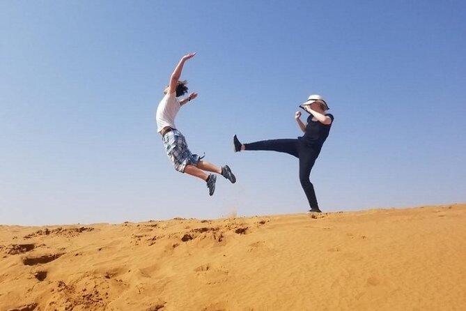 Evening Desert safari Dubai With Quad Bike Ride & BBQ dinner - From dunes to camp: the Arabic welcome and photo time