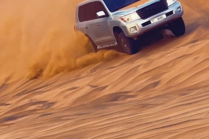 Evening Desert Safari with BBQ Buffet Camel Ride and Arabic Shows - ATV quad bikes and camel ride: two different ways to feel the dunes