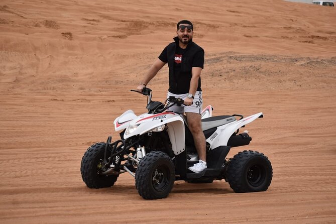 Evening Desert Safari with Quad Bike, Camel Ride & BBQ Dinner - Camel Farm Stop And Camel Trekking: Slower, Calmer Desert Time