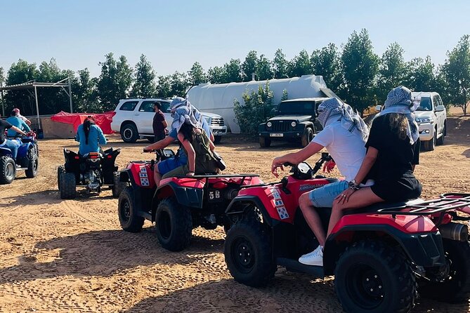 Evening Desert Safari with Quad Bike, Camel Ride & BBQ Dinner - Sandboarding, Henna, Falcon Photos, And Arabian Attire