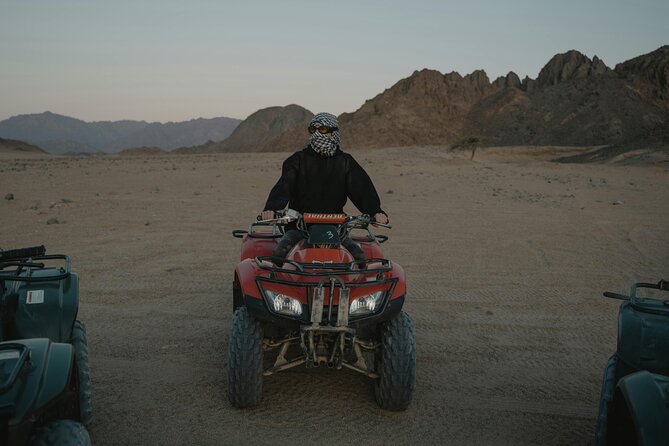 Evening Red Dunes Desert Safari In Dubai - Lahbab Desert Action: Dune Bashing, Sandboarding, and Camel Riding