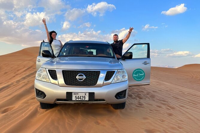 Experience the Ultimate Dubai Red Dunes Desert Safari BBQ Dinner - Desert camp night: henna, shisha, camel ride, belly dance, Tanoura, fire show