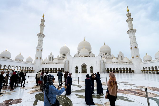 From Abu Dhabi: Grand Mosque, Qasr Al Watan Palace & Etihad Tower - Sheikh Zayed Grand Mosque: dress code, timing, and photo rules
