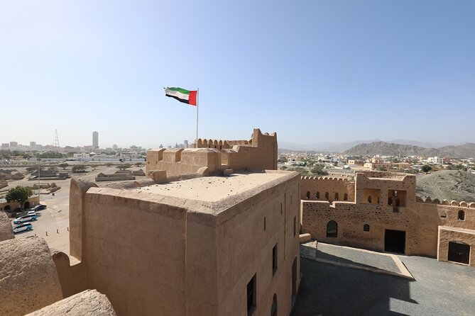 From Dubai to Fujairah: Full Day Tour with Sheikh Zayed Grand Mosque - Khor Fakkan: beachfront views, Resistance Monument photos, and a Portuguese fort angle