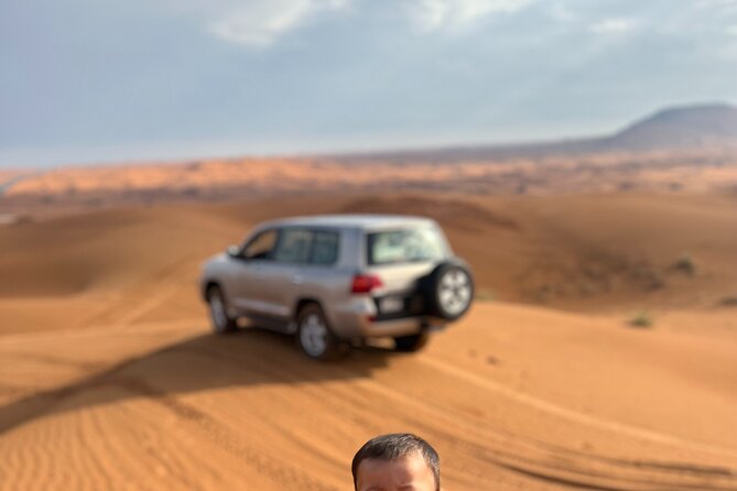 Half Day Desert Experience Camel Dune BBQ ATV option - Modern Bedouin Camp: Coffee, Falcon Display, and Live Shows
