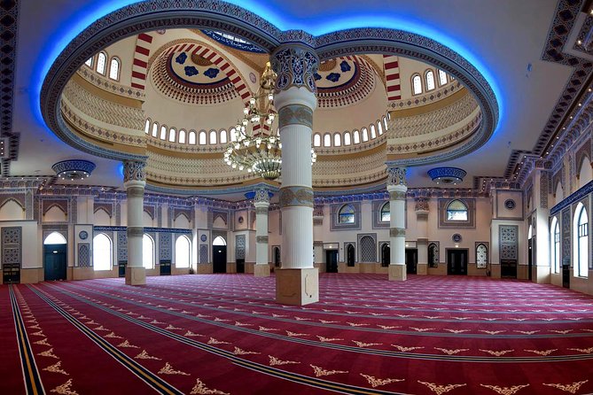 Half-Day Dubai City Tour with Blue Mosque, Creek, Souks & Abra - Modern photo moments: Atlantis, The Palm, Souk Madinat Jumeirah, and Burj Khalifa