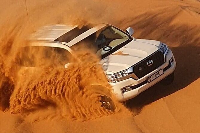High Red Dunes Thrilling Desert Safari Sand Boarding BBQ Dinner - Sandboarding and quad biking, choose your kind of fun