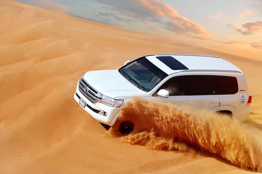 Luxury Dubai Desert Safari, BBQ, Camel Ride, Quad Bike, Show - Camel Rides, Falcon Display, Horse Rides, and Henna Painting