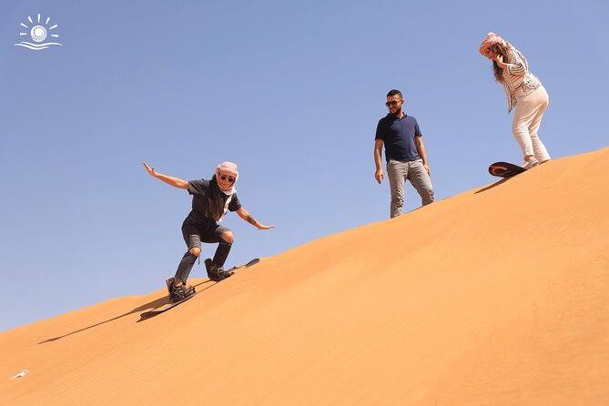 Morning Desert Safari in Dubai with Camel Ride - Sandboarding after the ride: fun on a steep learning curve