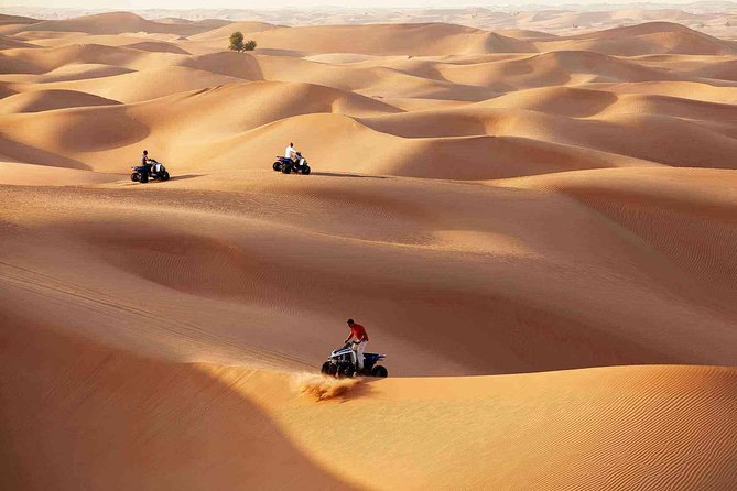 Morning Desert Safari with Quad Bike Tour Abu Dhabi - Quad bike, sand boarding, and the included costume photo