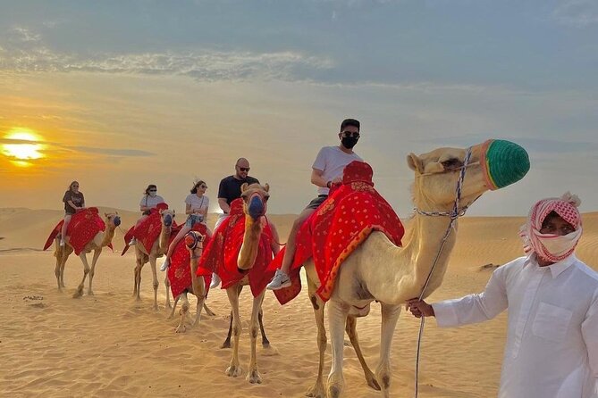 Morning Desert Safari with Sandboarding & Camel Ride on Red Dunes - Pickup in an air-conditioned 4x4, then straight to the dunes