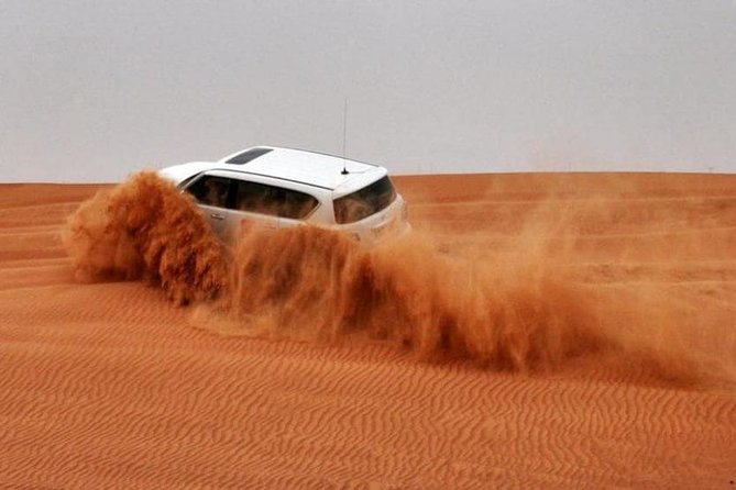 Morning Red Dunes Safari: Quad Biking, Sandboarding & Camel Ride - Sandboarding and the High-Dune Photo Stop