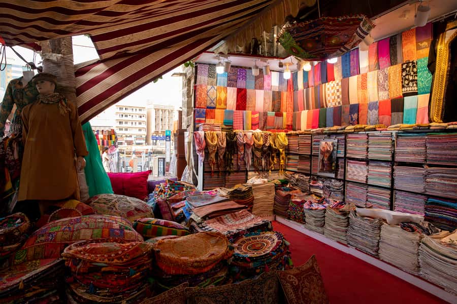 Old Dubai Historic Guided Tour: Creek, Street Food & Souks - Bur Dubai market streets and the abra dock, switching gears in 15 minutes