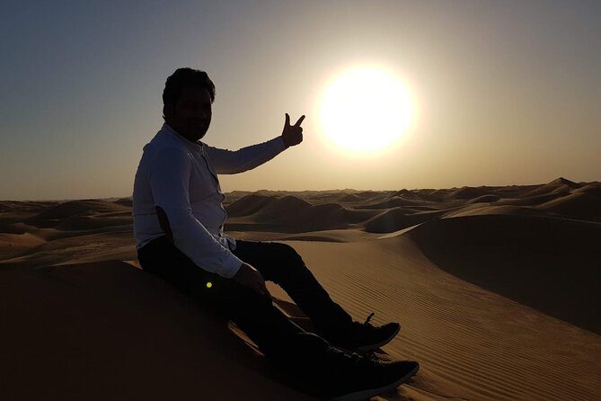 Premium Desert Safari in Dubai with Buffet Dinner - Camp arrival: the desert slows down for camel, sand, and photos