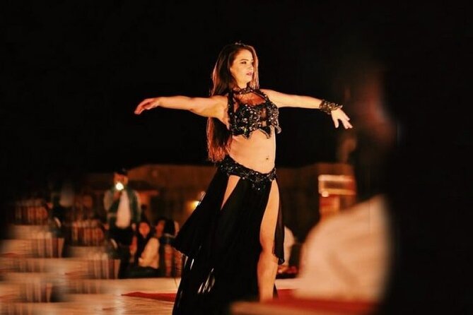 Premium Desert Safari with Dinner, Dunes and Ten Shows (VIP) - Camel ride and sand boarding: the classic desert contrast